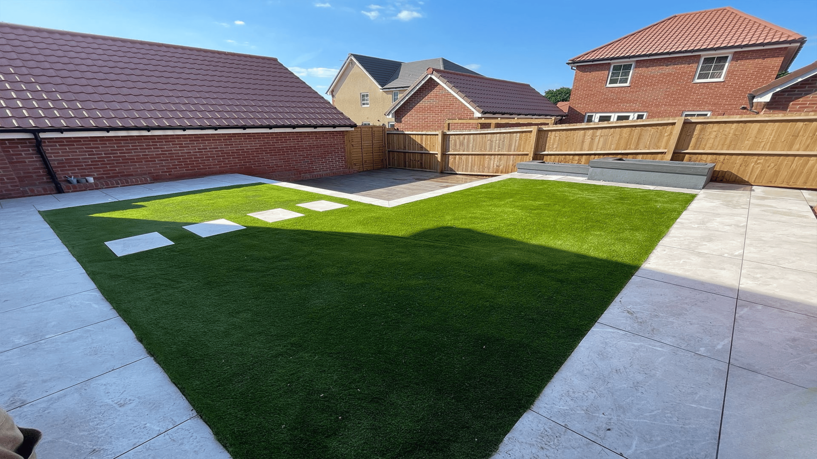 Modern front garden featuring clean lines, gravel borders, low-maintenance planting, and a stylish pathway leading to the entrance